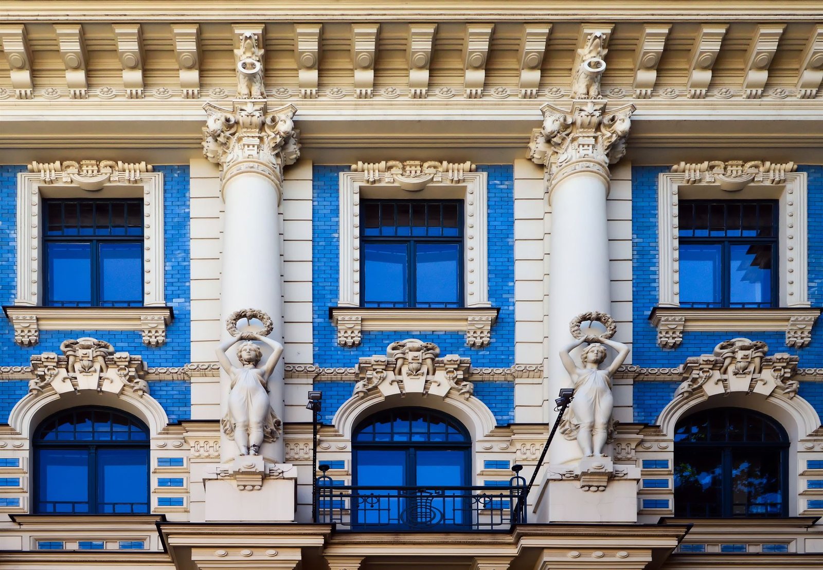 Blue-tiled Art Nouveau façade on Strēlnieku iela 4a, Riga, across from Art Cafe Sienna