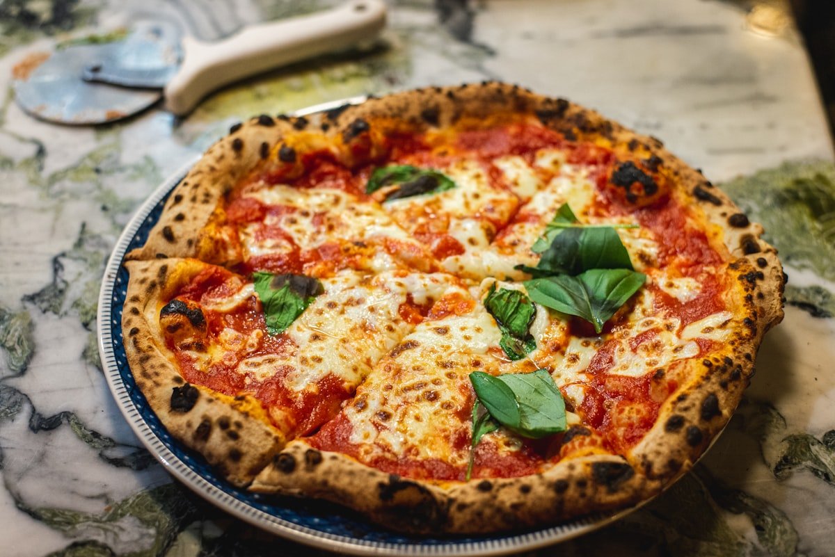 Wood-fired style pizza representing The Food Lab Waw pizza